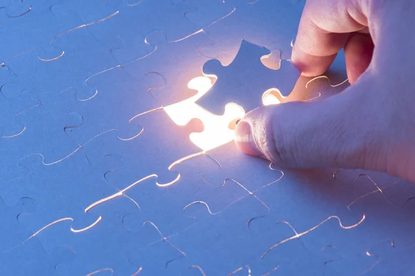 Hand holding Missing jigsaw puzzle piece — Stock Photo, Image