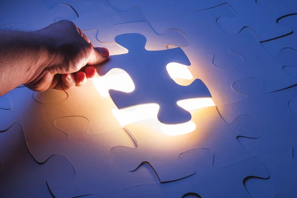 Hand holding Missing jigsaw puzzle piece — Stock Photo, Image