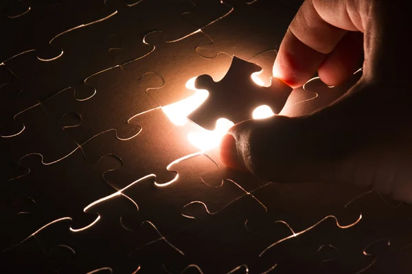 Hand holding Missing jigsaw puzzle piece — Stock Photo, Image