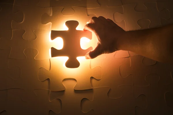 Hand holding Missing jigsaw puzzle piece — Stock Photo, Image