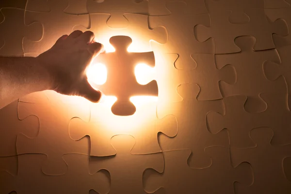 Hand holding Missing jigsaw puzzle piece — Stock Photo, Image