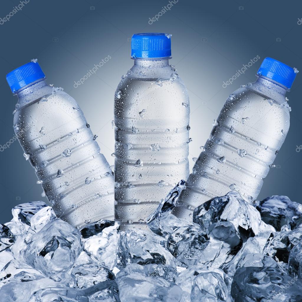 Cold Water Bottles On Ice Cubes Stock Photo by ©somchaij 64740947