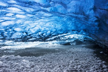 Ice cave in a glacier clipart