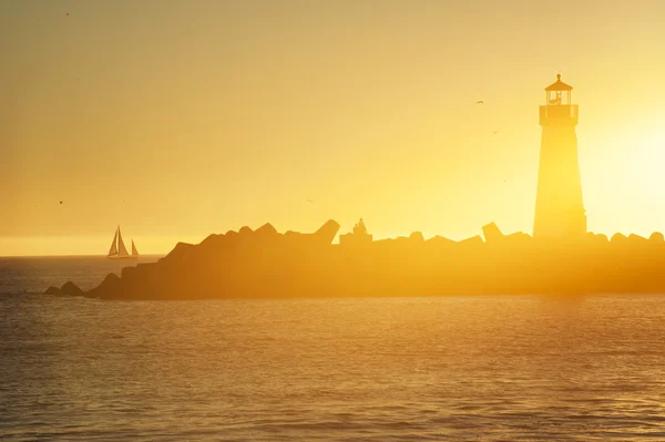 Lighthouse and surf boat — Stock Photo, Image