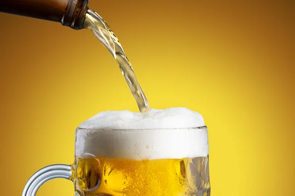 Beer pour from Bottle to Glass — Stock Photo, Image