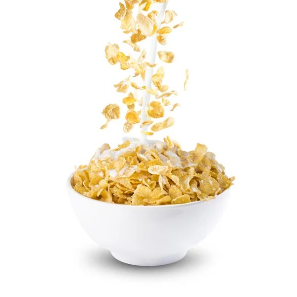 Corn Flakes and Milk Splash on Bowl — стокове фото