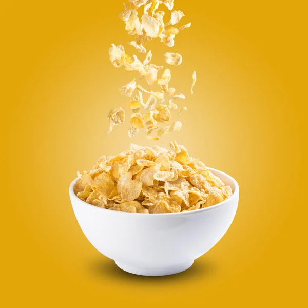 Cereal Corn Flakes Falling Into A Bowl — Stock Photo, Image