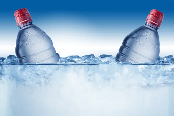 Cold Water Bottles On Ice Cubes Stock Photo by ©somchaij 64740945