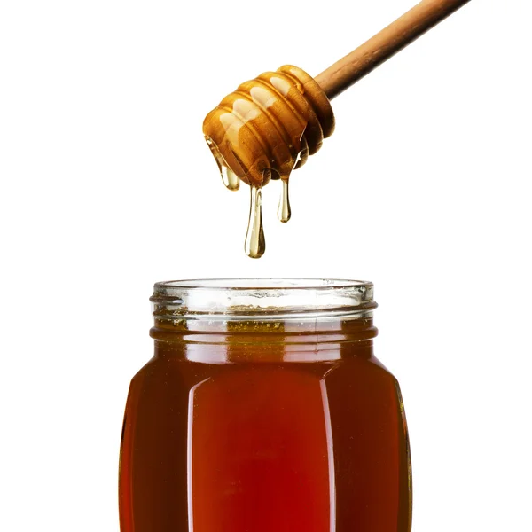 蜂蜜滴，从滴到罐子里 — 图库照片