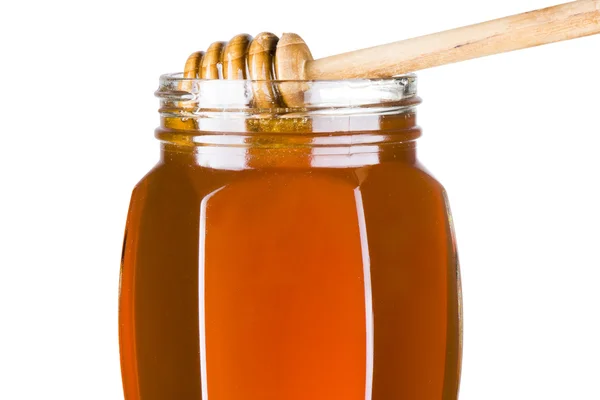 Dipper med flydende honning over - Stock-foto