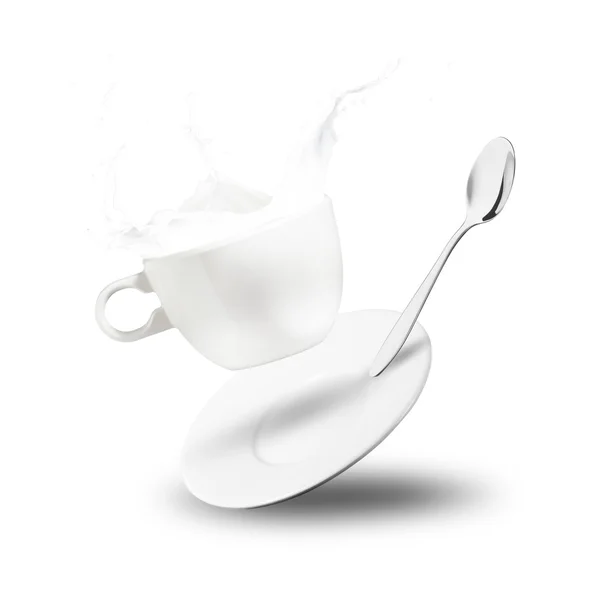 Выплеск молока из чашки — стоковое фото