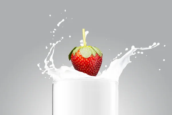 Strawberries Falling On Milk Splash — Stock Photo, Image