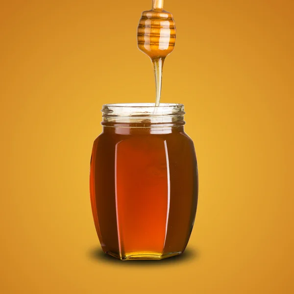 Dipper with flowing honey over — Stock Photo, Image