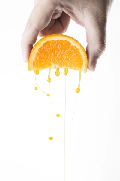 Hand Squeeze Orange Slice — Stock Photo, Image