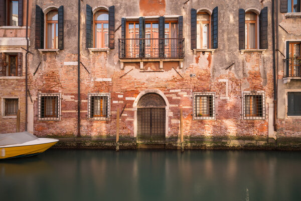 A view of old buildings along the Venetian Canals in the Cannaregio District of Venice.