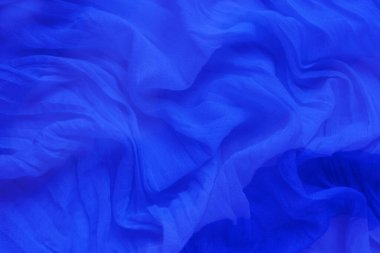 Dalgalı güzel mavi doğal havadar kumaş, desen soyut arka plan.