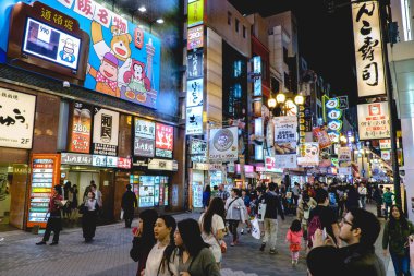 Osaka, Japan: Streets of Dotonbori district with restaurants, neon, wires, colors and people