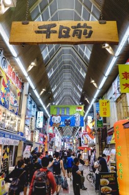 Osaka, Japan: Streets of Dotonbori district with restaurants, neon, wires, colors and people