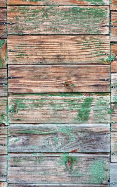 Textura de parede feita de tábuas com pintura descascando — Fotografia de Stock
