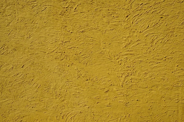 La texture des murs de couleur moutarde peints grands traits erratiques — Photo