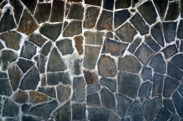 The wall of the large gray-brown polished stones — Stock Photo, Image