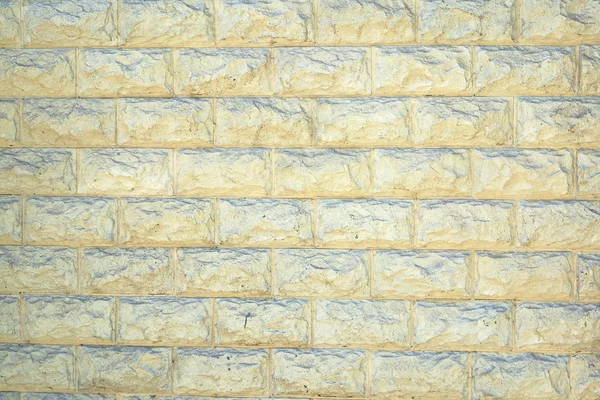 Le mur des grandes pierres rectangulaires jaune clair comme un backg — Photo