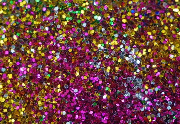 Small multicolored sequins as background — Stock Photo, Image