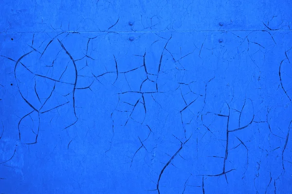 Mur fissuré bleu comme fond abstrait — Photo