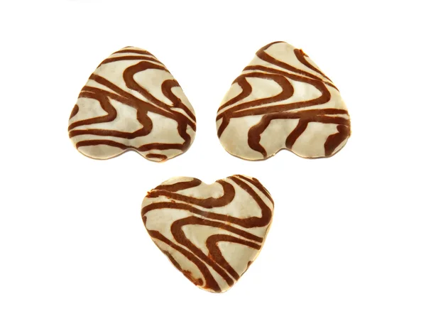 Drie cookies, bedekt met whthree hart-vormige cookies gedekt Stockfoto