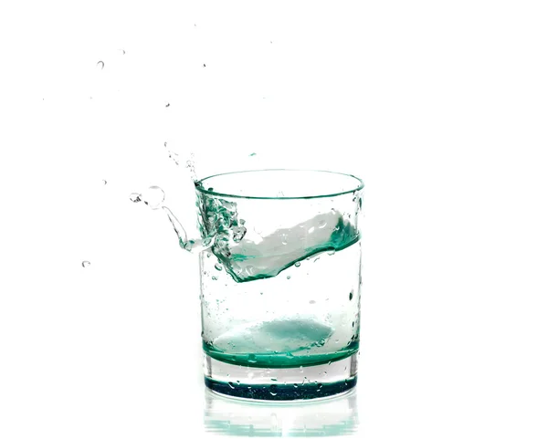 Splashes of water in a glass Стоковая Картинка