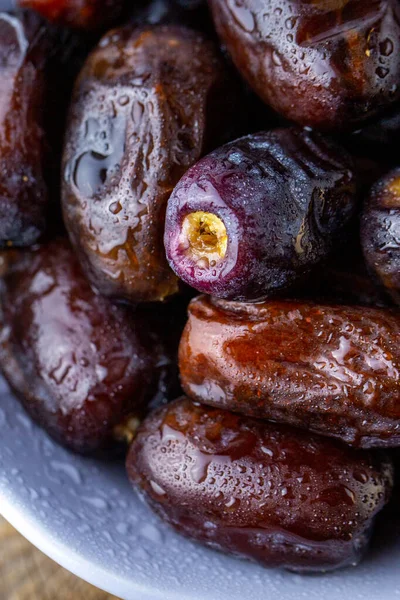 Ramadan Kareem.Date fruit close-up.Date fruit. Fresh young date close-up. The fruit is useful. Sweets for tea. Healthy nutrition concept