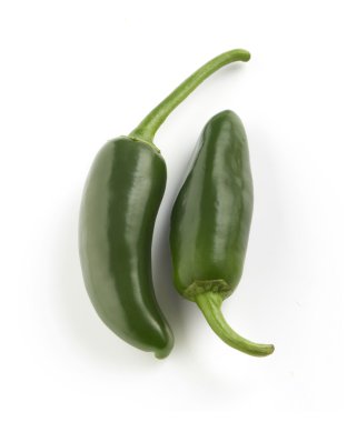 green peppers on a white surface clipart