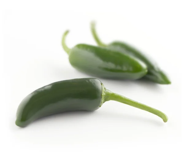 Green pepers on a white backgorund — Stock Photo, Image