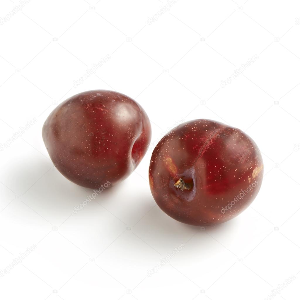 Pair of Red Plums on White Background