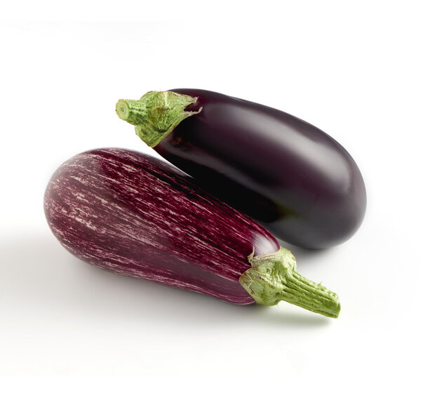 Two whole fresh aubergine varieties