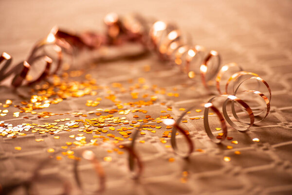 Serpentine and glitter on a table at a party.