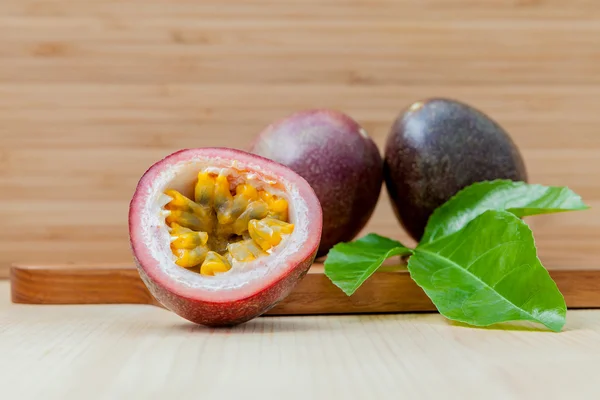 Fresh passion fruits set up on wooden background. — Stock Photo, Image
