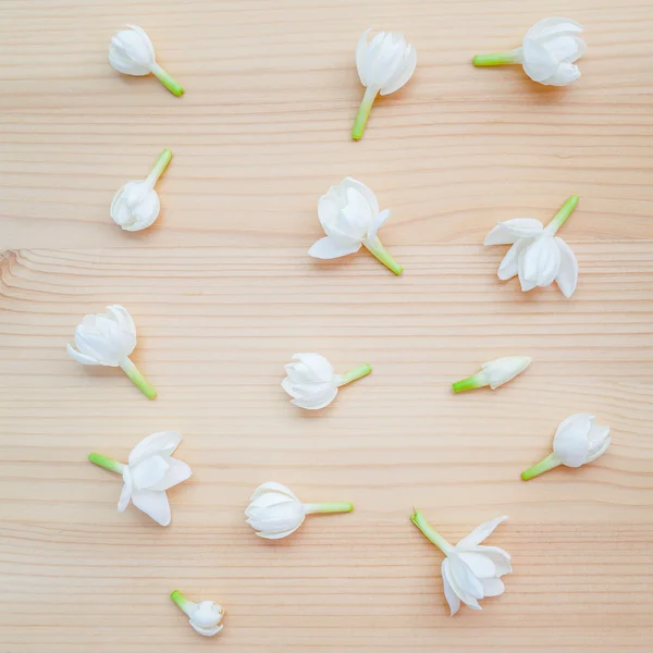 White jasmine flowers on wooden background. The delicate rain se — Stock Photo, Image