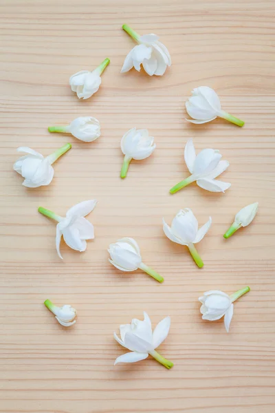 White jasmine flowers on wooden background. The delicate rain se — Stock Photo, Image