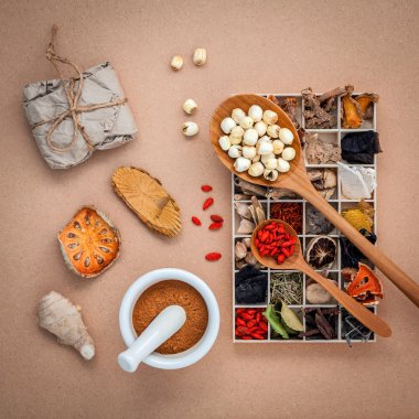 Alternative health care dried various Chinese herbs in wooden bo