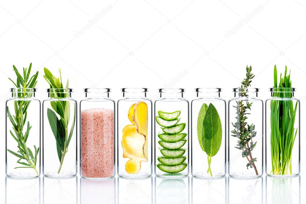 Alternative skin care and homemade scrubs with natural ingredients  in glass bottles isolate on white background.