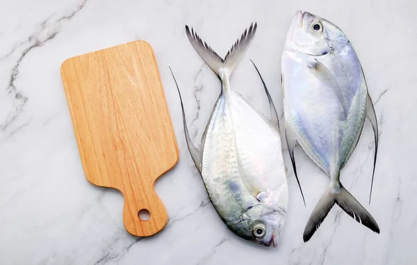 Fresh Longfin Trevally Fish Set White Marble Kitchen Background Вид — стоковое фото
