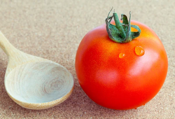 The giant red tomato with wooden spoon. - Healthy food concept. — Stock Photo, Image