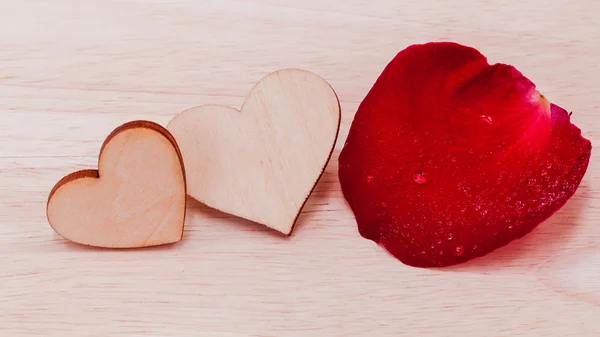 The wooden hearts on wooden background. - Concept for love and w — Stock Photo, Image