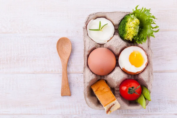 Boiled eggs for breakfast on wooden table. — Stock Photo, Image