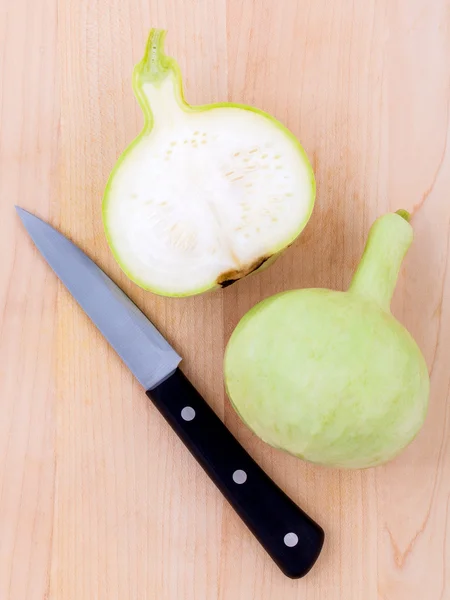 Halved bottle gourd,calabash gourd ,flowered gourd on wooden — Stock Photo, Image