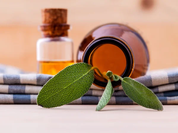 Natural Spa Ingredients sage essential oil for aromatherapy with — Stock Photo, Image