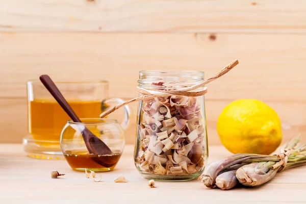 Cup of herbal tea with dried lemon grass ,honey and lemon on woo — Stock Photo, Image