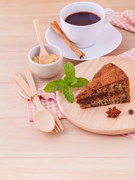 Homemade dark chocolate cake with cup of coffee on wooden backgr Stock Image