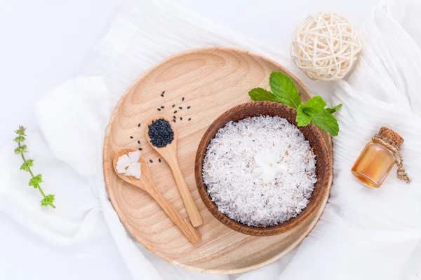 Raw coconut and coconut essential oils  with sea salt and herbs — Stock Photo, Image